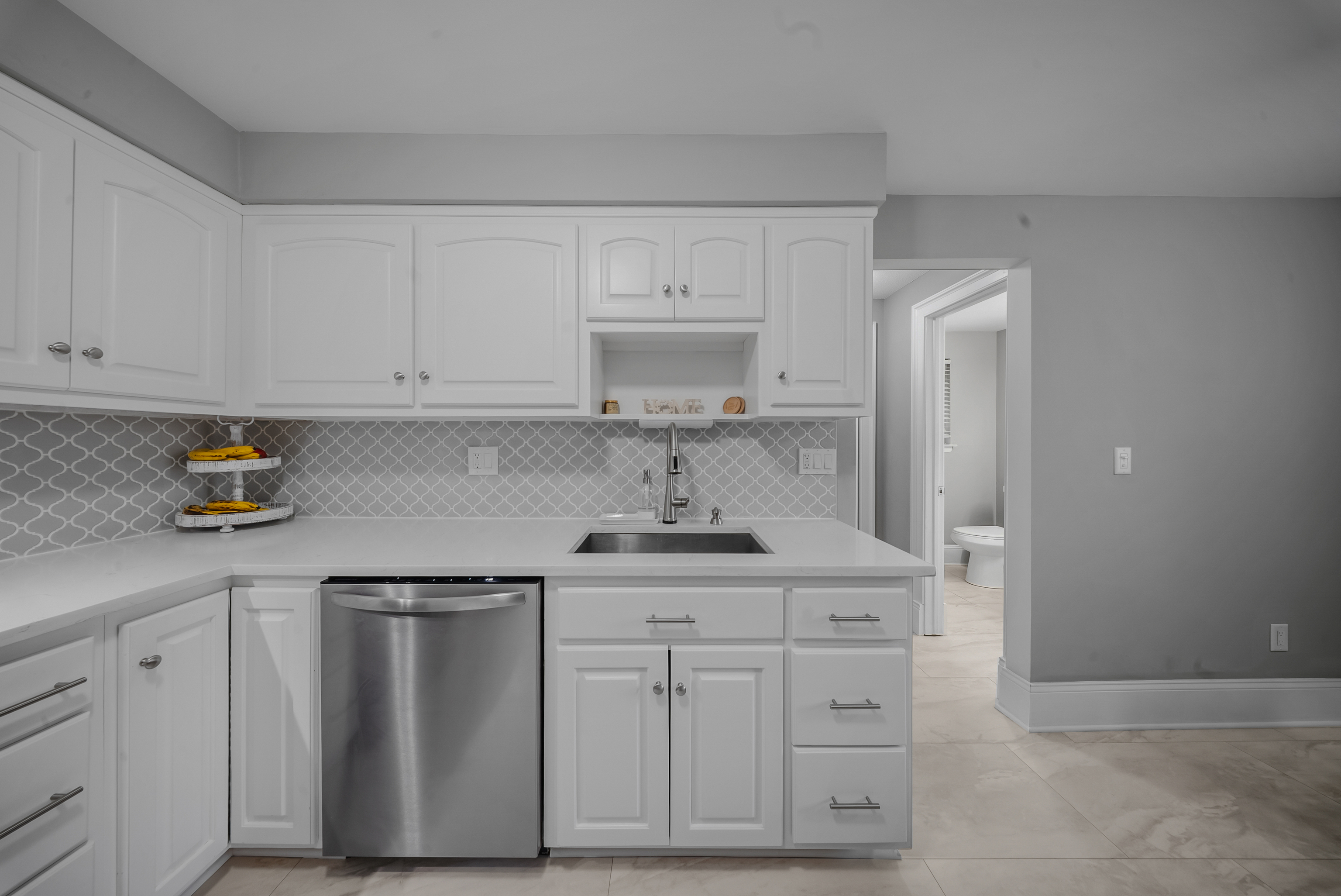 76 River Bend Road, Unit C Stratford, CT 06614 - Photo 4 of 26 a kitchen with white cabinets