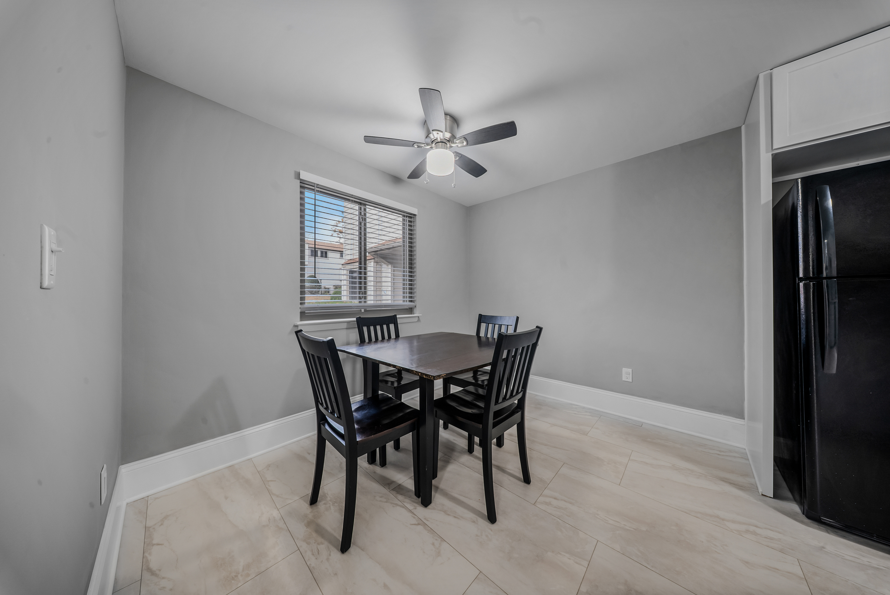 76 River Bend Road, Unit C Stratford, CT 06614 - Photo 6 of 26 a view of a dining room with furniture and a chandelier fan