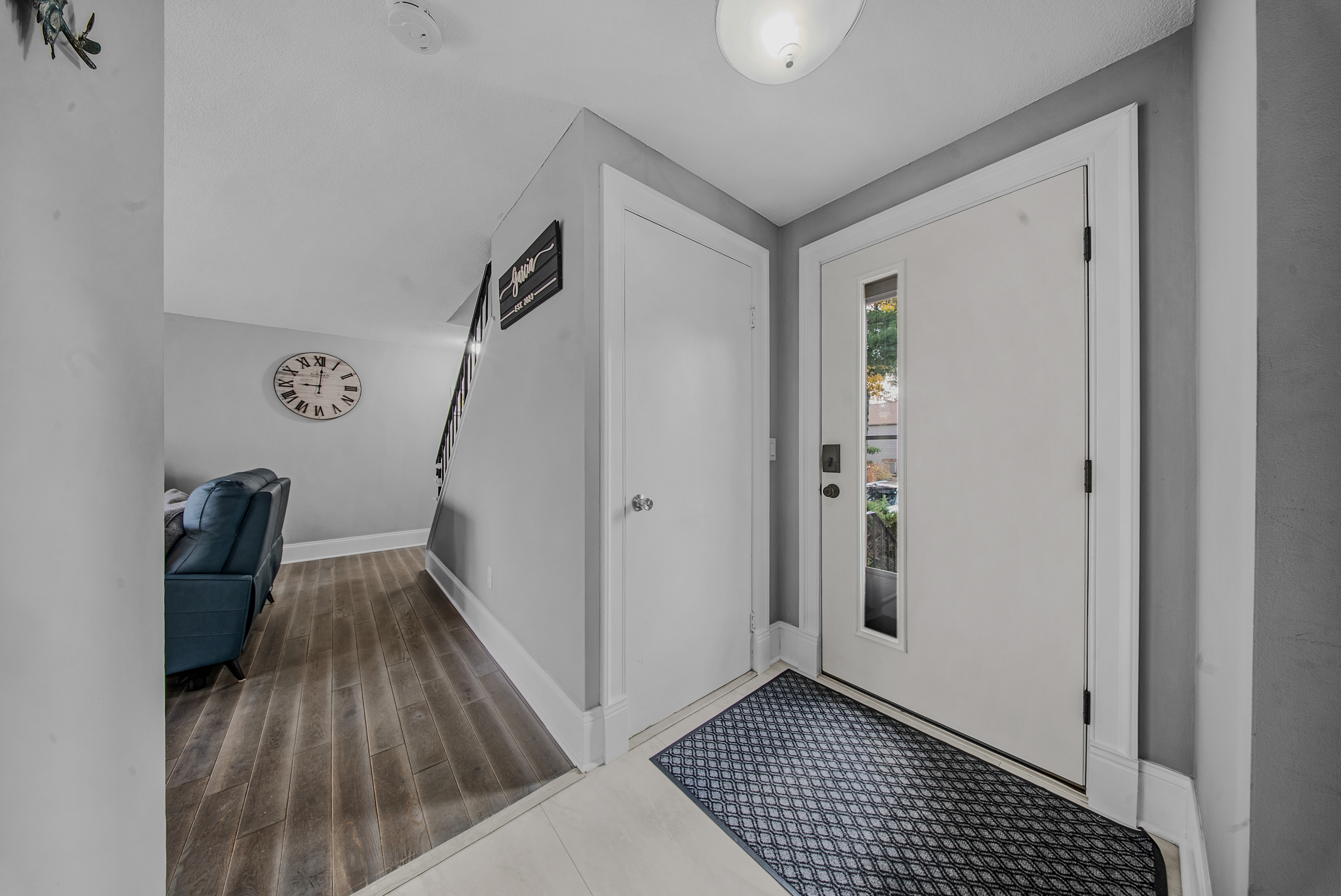 76 River Bend Road, Unit C Stratford, CT 06614 - Photo 8 of 26 a view of a hallway with wooden floor and stairs
