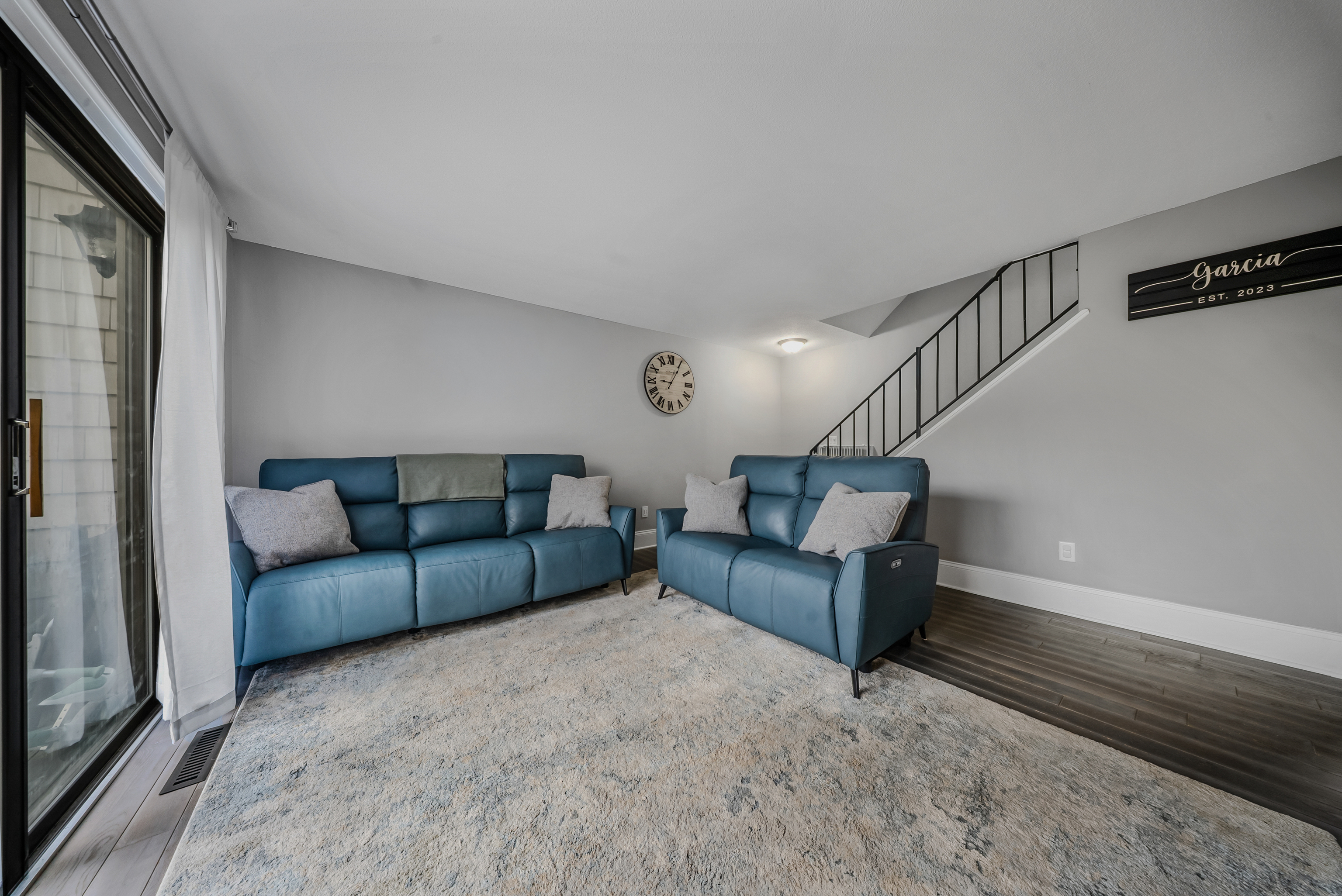 76 River Bend Road, Unit C Stratford, CT 06614 - Photo 9 of 26 a living room with furniture and stairs