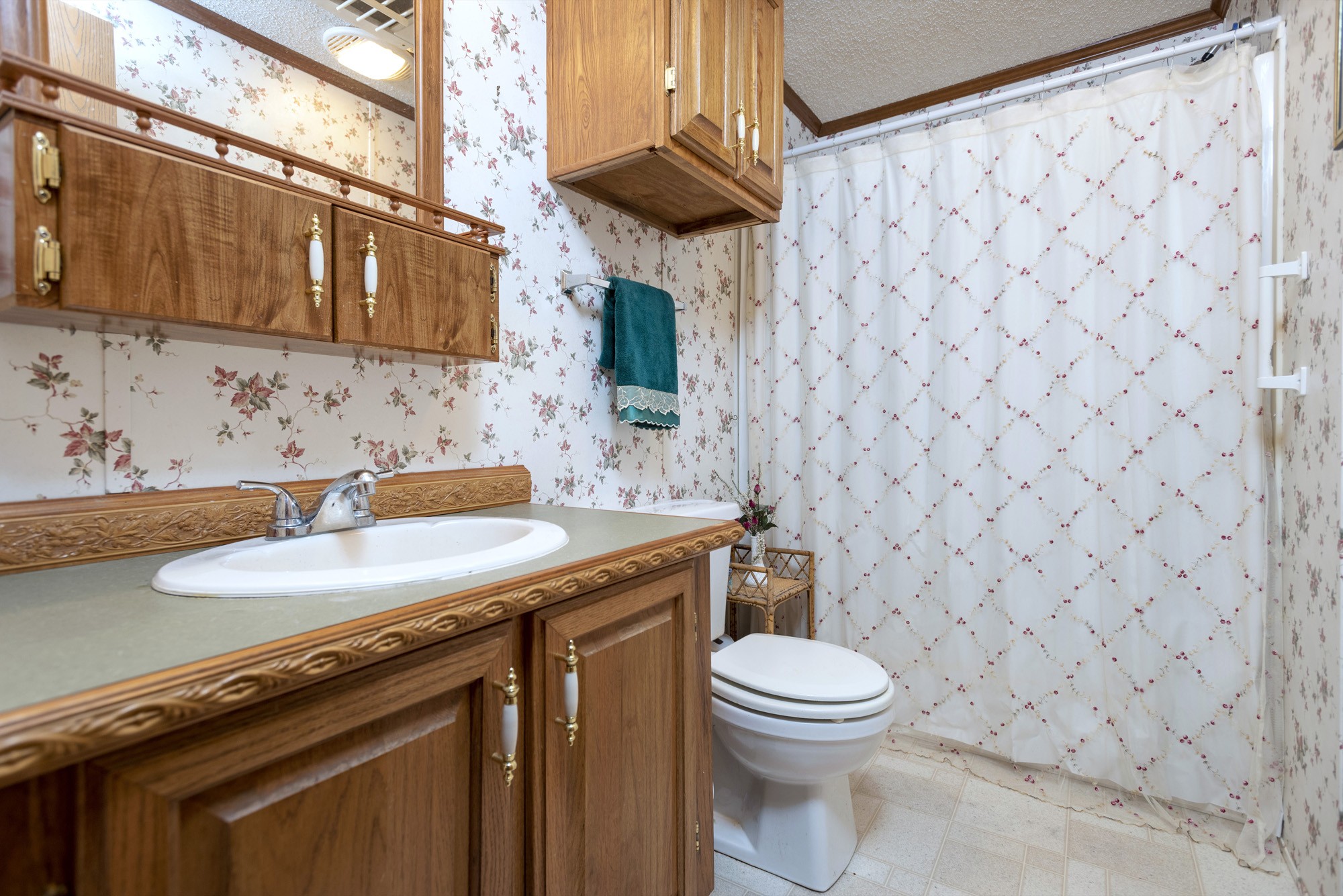 3941 Akin Ridge Road Williamsport, TN 38487 - Photo 13 of 18 a bathroom with a granite countertop toilet sink and mirror
