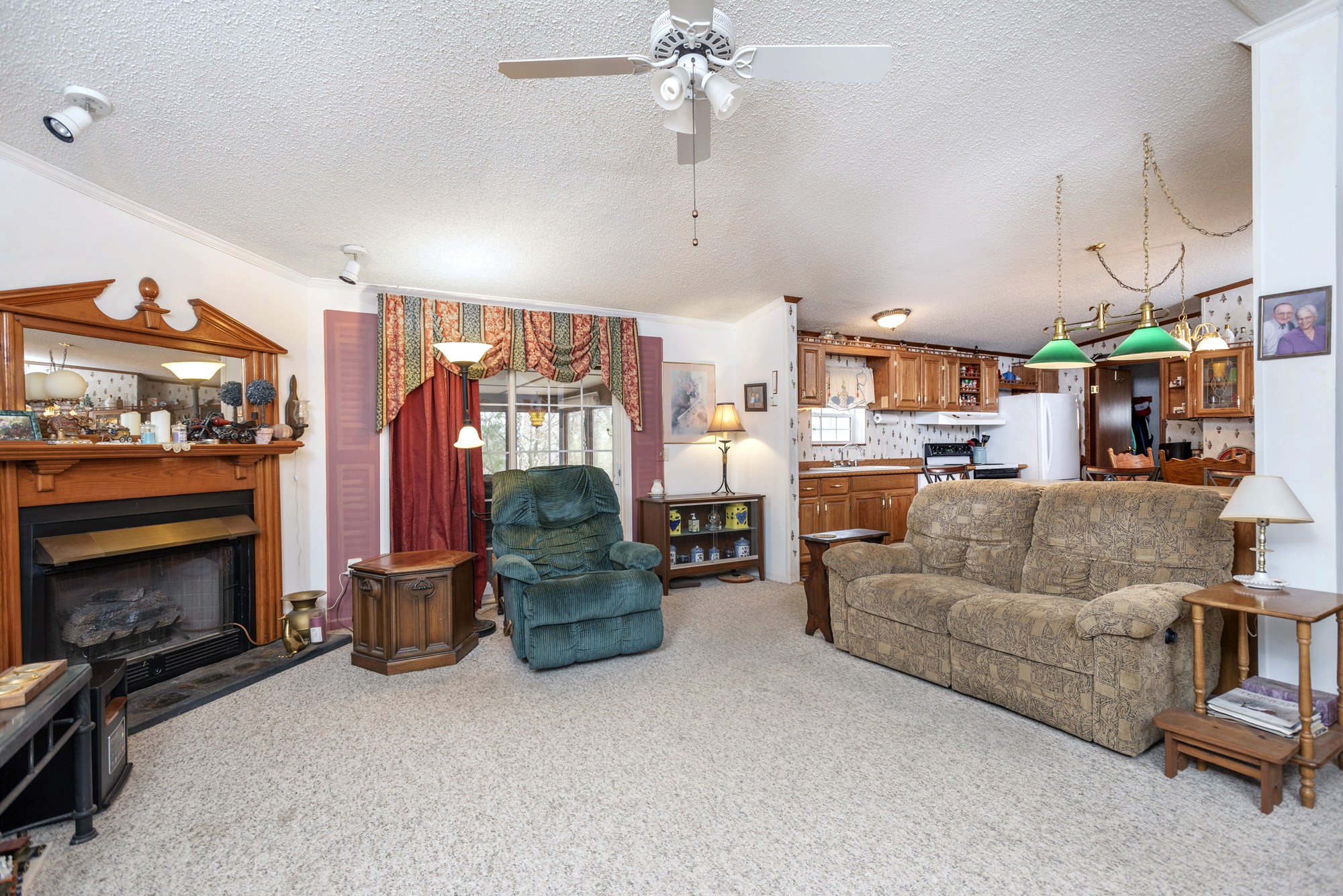 3941 Akin Ridge Road Williamsport, TN 38487 - Photo 2 of 18 a living room with furniture and a fireplace