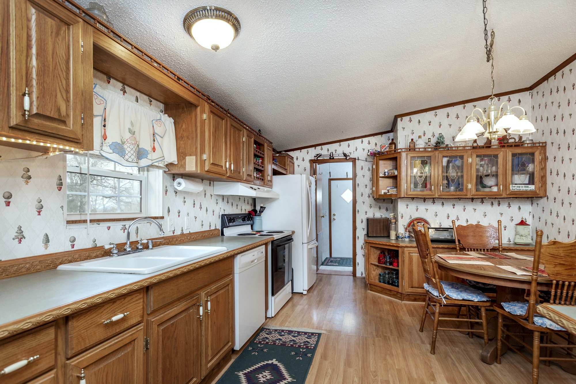 3941 Akin Ridge Road Williamsport, TN 38487 - Photo 3 of 18 a kitchen with stainless steel appliances a refrigerator and a sink