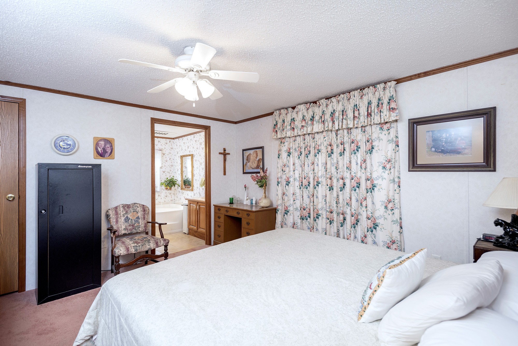 3941 Akin Ridge Road Williamsport, TN 38487 - Photo 9 of 18 a bedroom with a bed and a chandelier