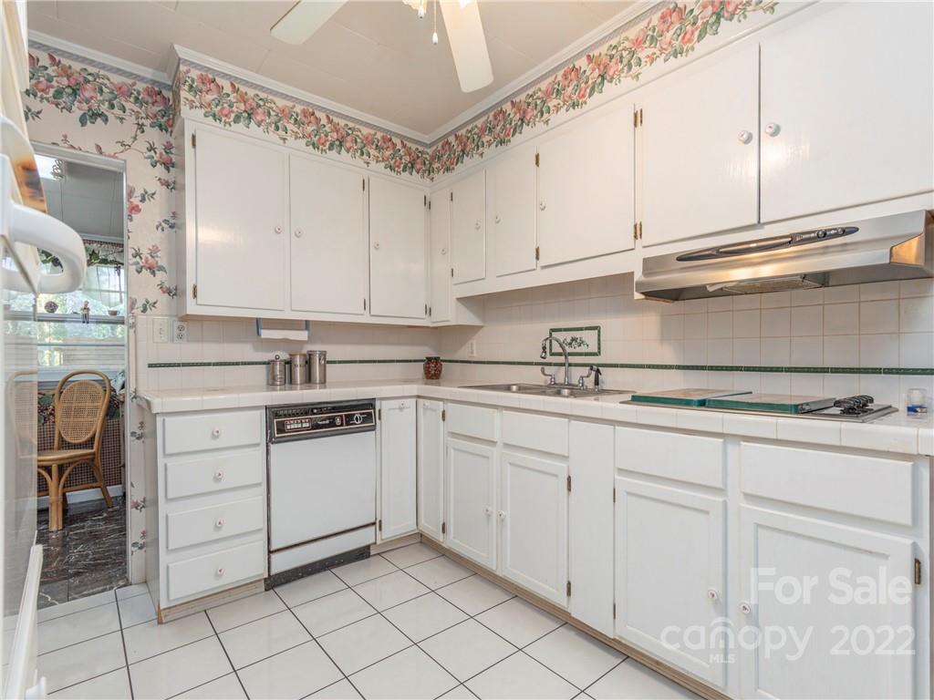 7 Buckner Road Canton, NC 28716 - Photo 7 of 27 a kitchen with cabinets appliances a sink and a counter top