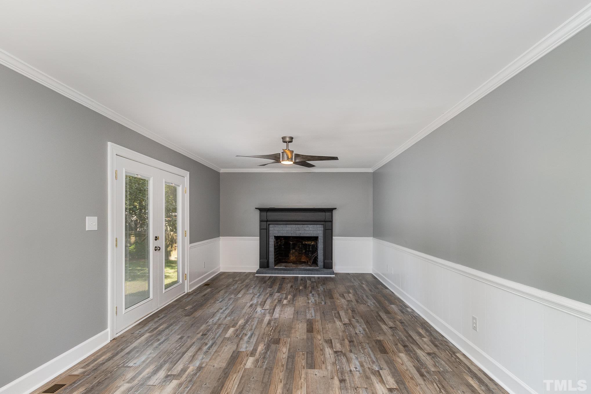 14 Eden Drive Smithfield, NC 27577 - Photo 11 of 37 wooden floor fireplace and natural light in room