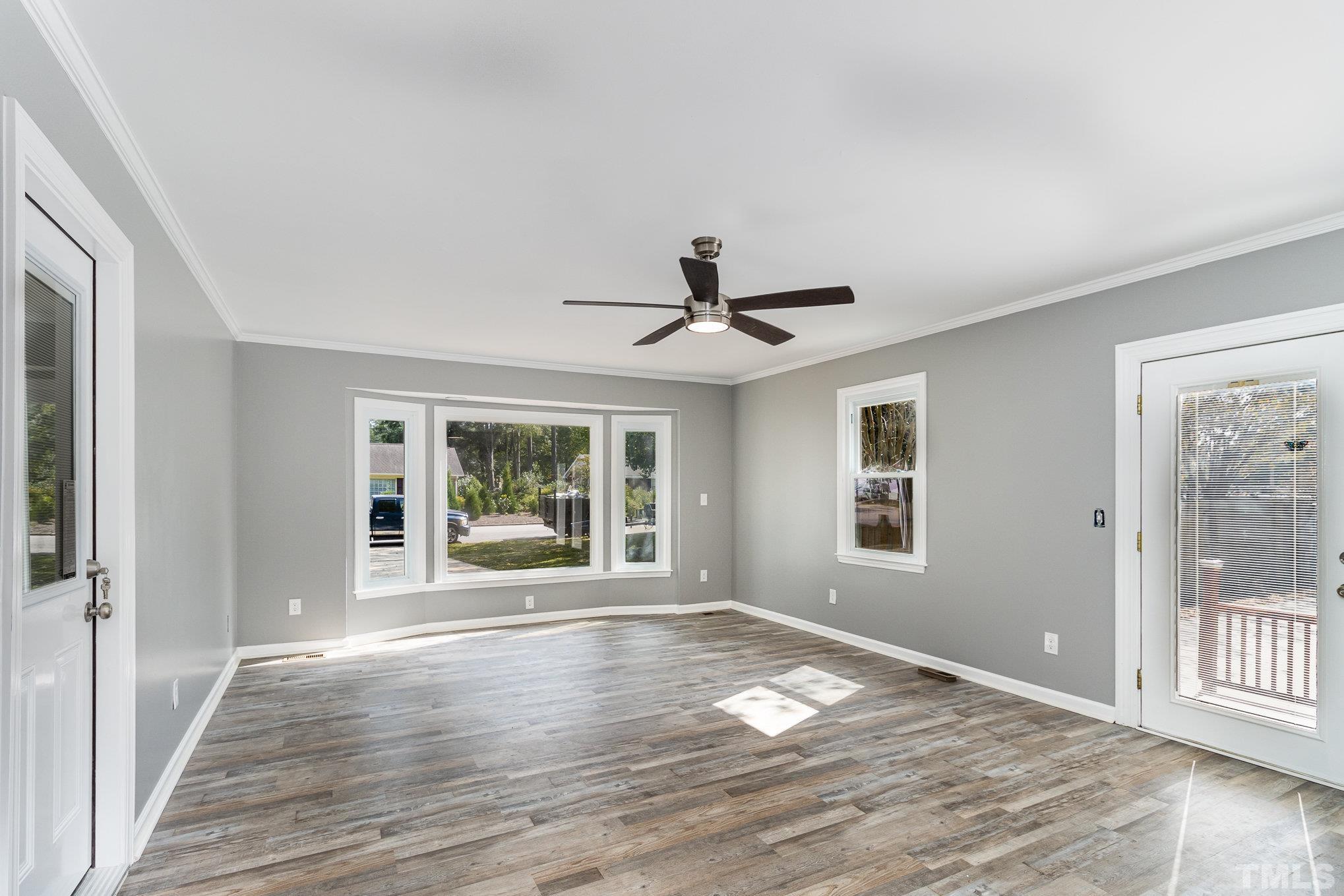 14 Eden Drive Smithfield, NC 27577 - Photo 12 of 37 a view of an empty room with wooden floor and a window