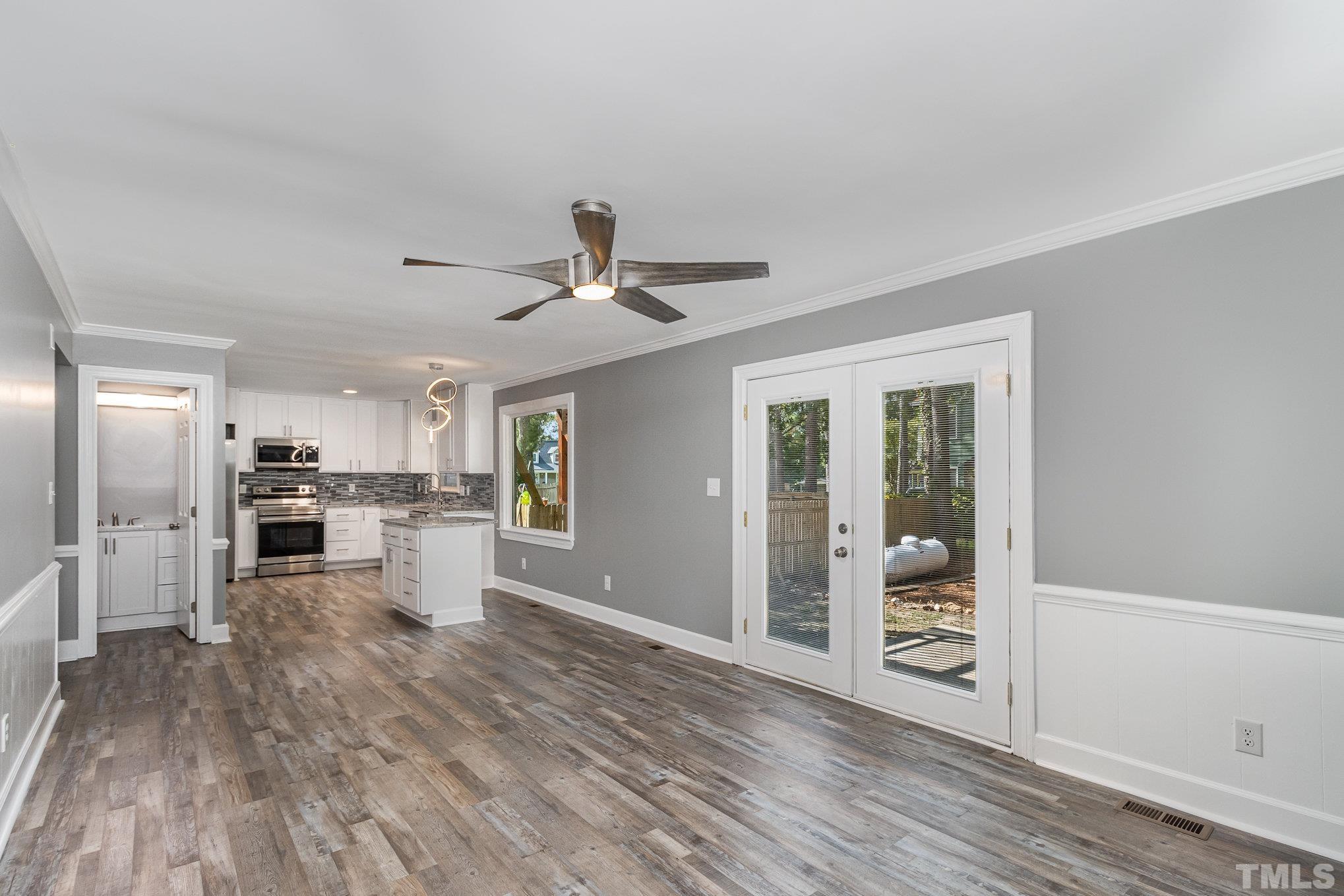 14 Eden Drive Smithfield, NC 27577 - Photo 16 of 37 a view of a kitchen with wooden floor and a ceiling fan