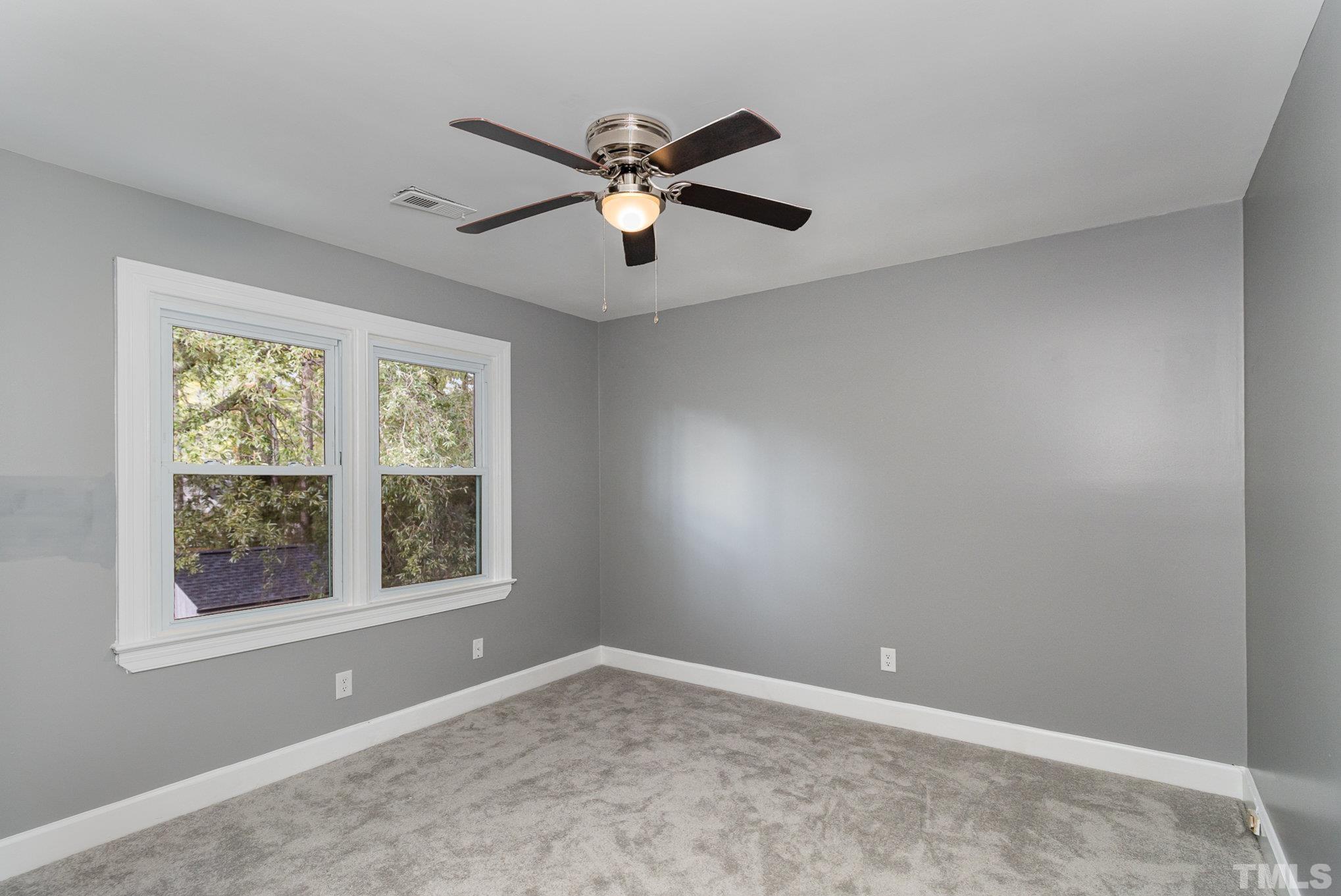 14 Eden Drive Smithfield, NC 27577 - Photo 19 of 37 a view of an empty room with a window