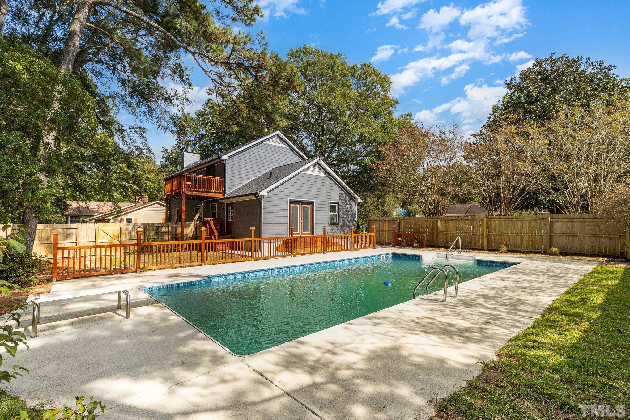 14 Eden Drive Smithfield, NC 27577 - Photo 30 of 37 a front view of house with yard and trees in the background
