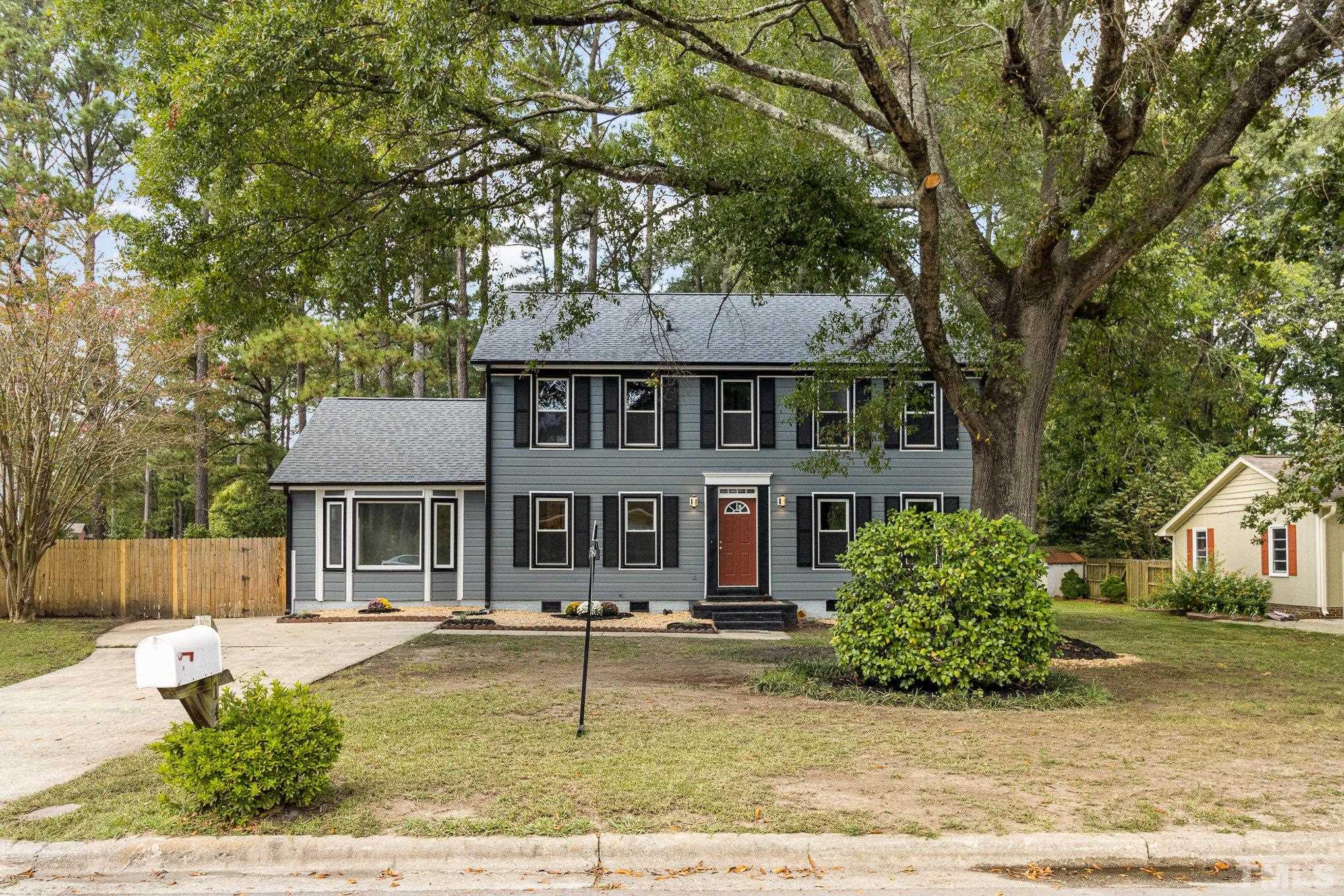 14 Eden Drive Smithfield, NC 27577 - Photo 35 of 37 front view of a house with a tree