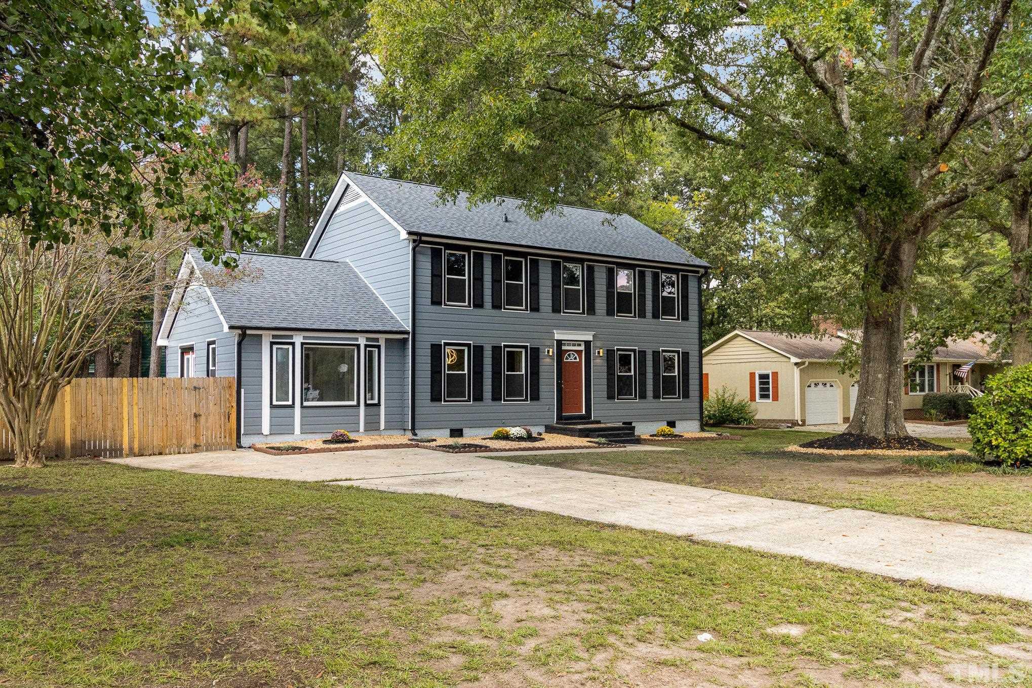 14 Eden Drive Smithfield, NC 27577 - Photo 5 of 37 a front view of a house with a garden