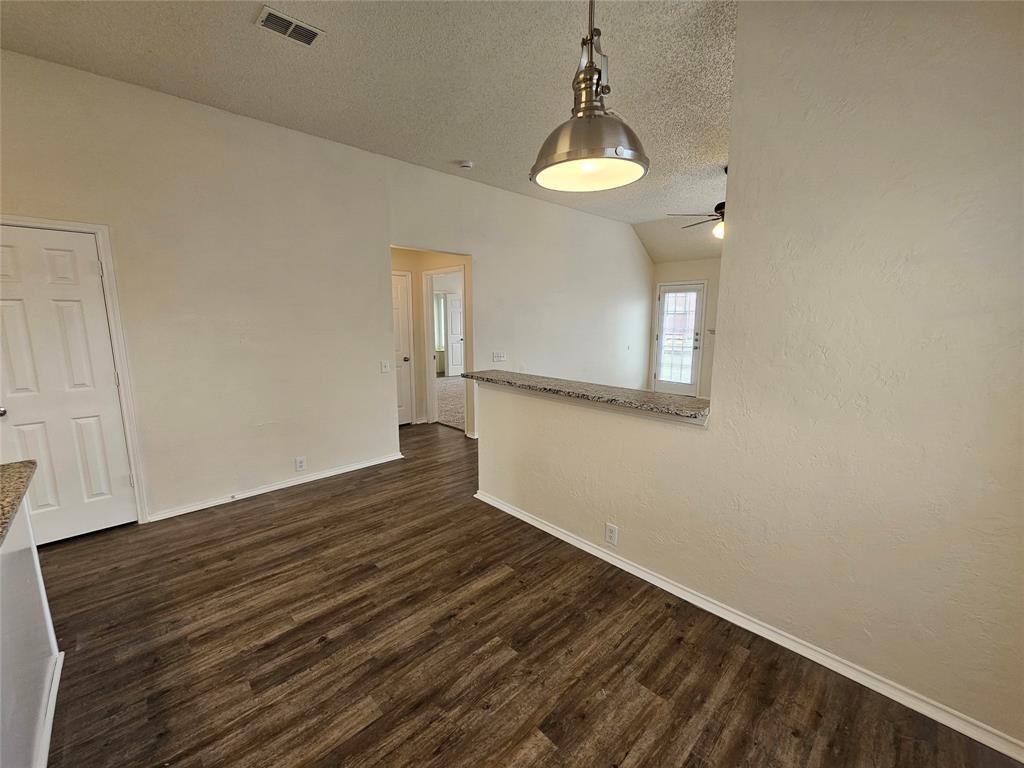 7851 Orland Park Circle Fort Worth, TX 76137 - Photo 22 of 35 a view of a room with wooden floor and a window