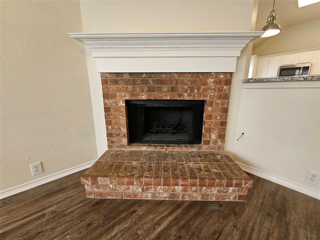 7851 Orland Park Circle Fort Worth, TX 76137 - Photo 23 of 35 a living room with a fireplace