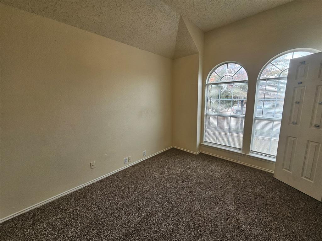 7851 Orland Park Circle Fort Worth, TX 76137 - Photo 4 of 35 an empty room with windows