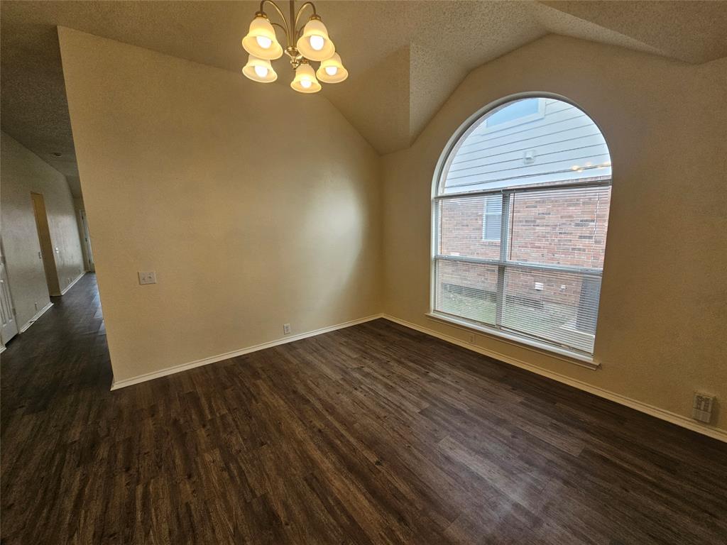 7851 Orland Park Circle Fort Worth, TX 76137 - Photo 5 of 35 wooden floor in an empty room with a window
