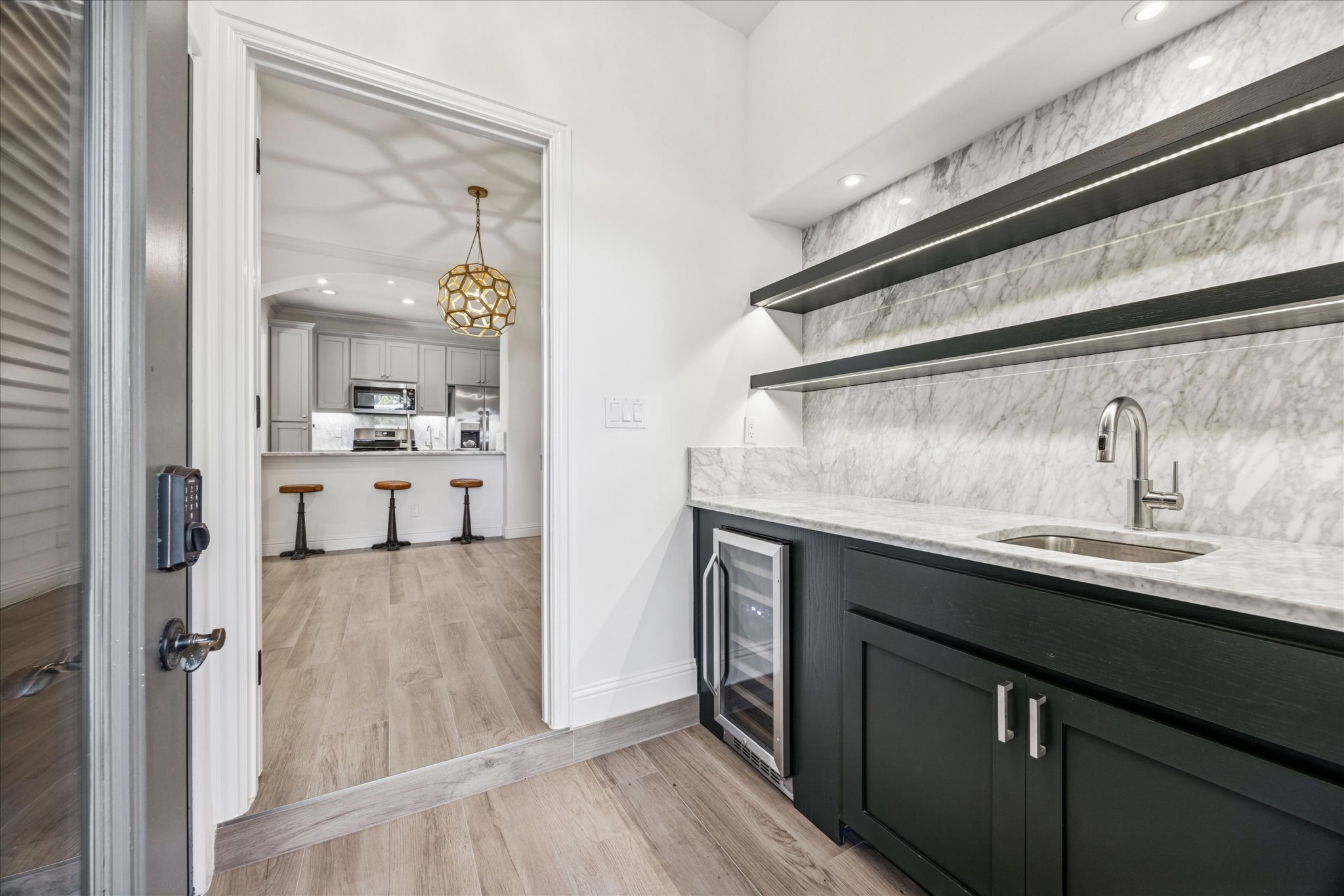 3303 Pecos Street, Unit B Austin, TX 78703 - Photo 15 of 30 a kitchen with a sink and refrigerator