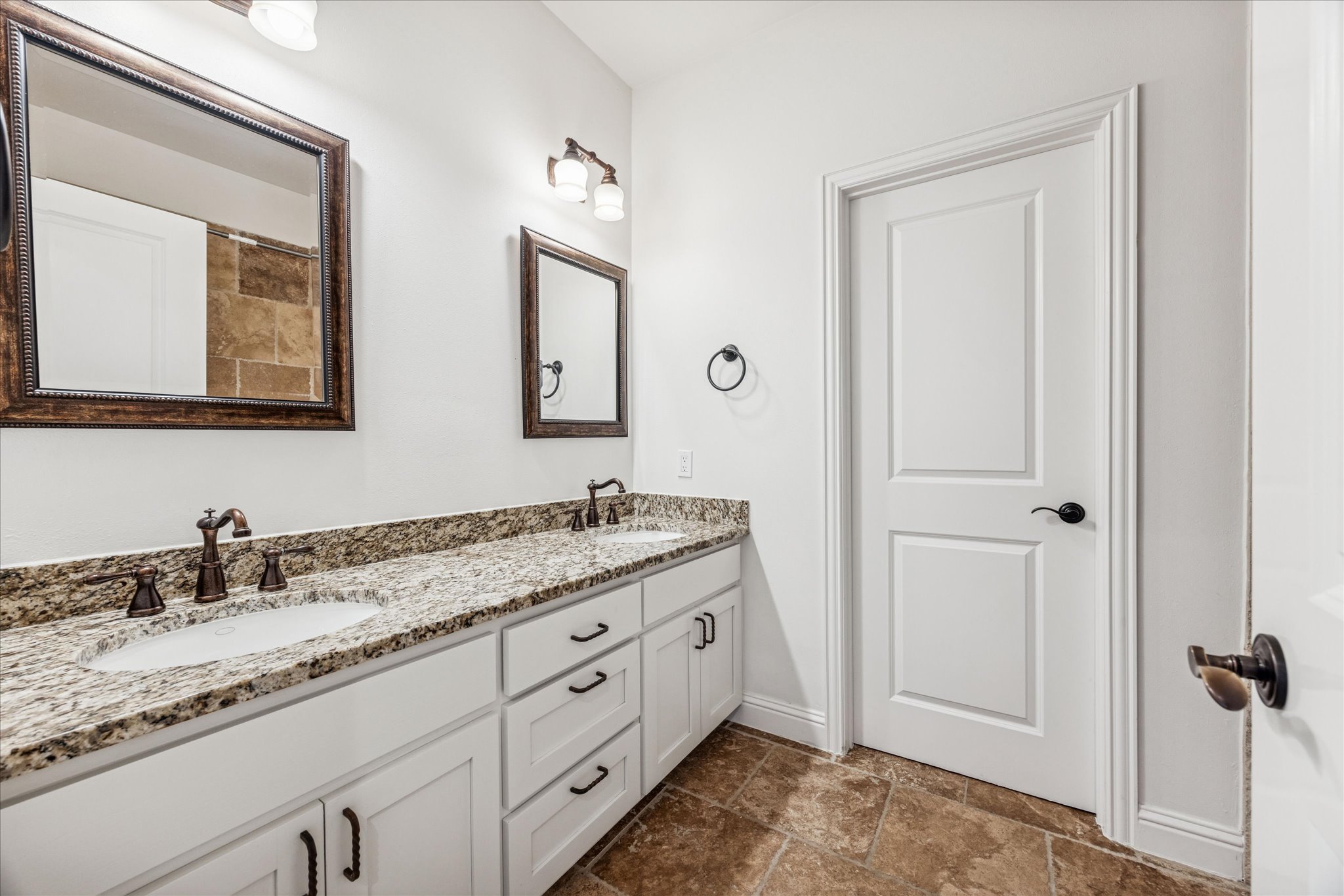 3303 Pecos Street, Unit B Austin, TX 78703 - Photo 25 of 30 a bathroom with a granite countertop sink vanity and mirror