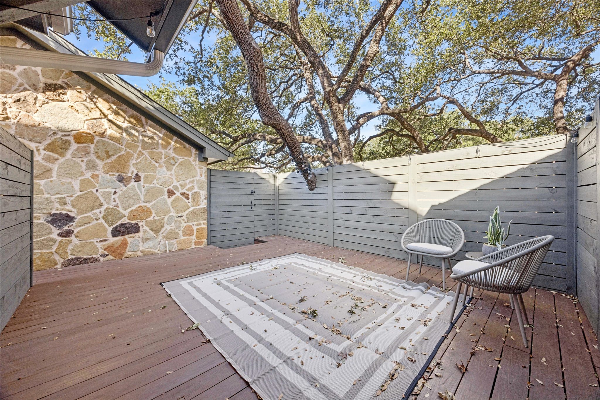 3303 Pecos Street, Unit B Austin, TX 78703 - Photo 29 of 30 a backyard of a house with seating space