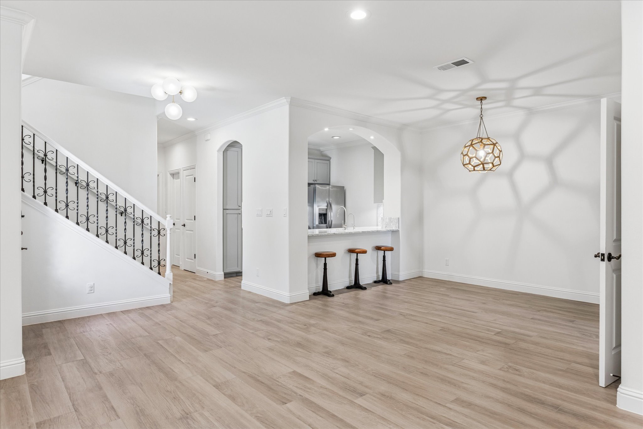 3303 Pecos Street, Unit B Austin, TX 78703 - Photo 5 of 30 a view of a room with wooden floor and white walls
