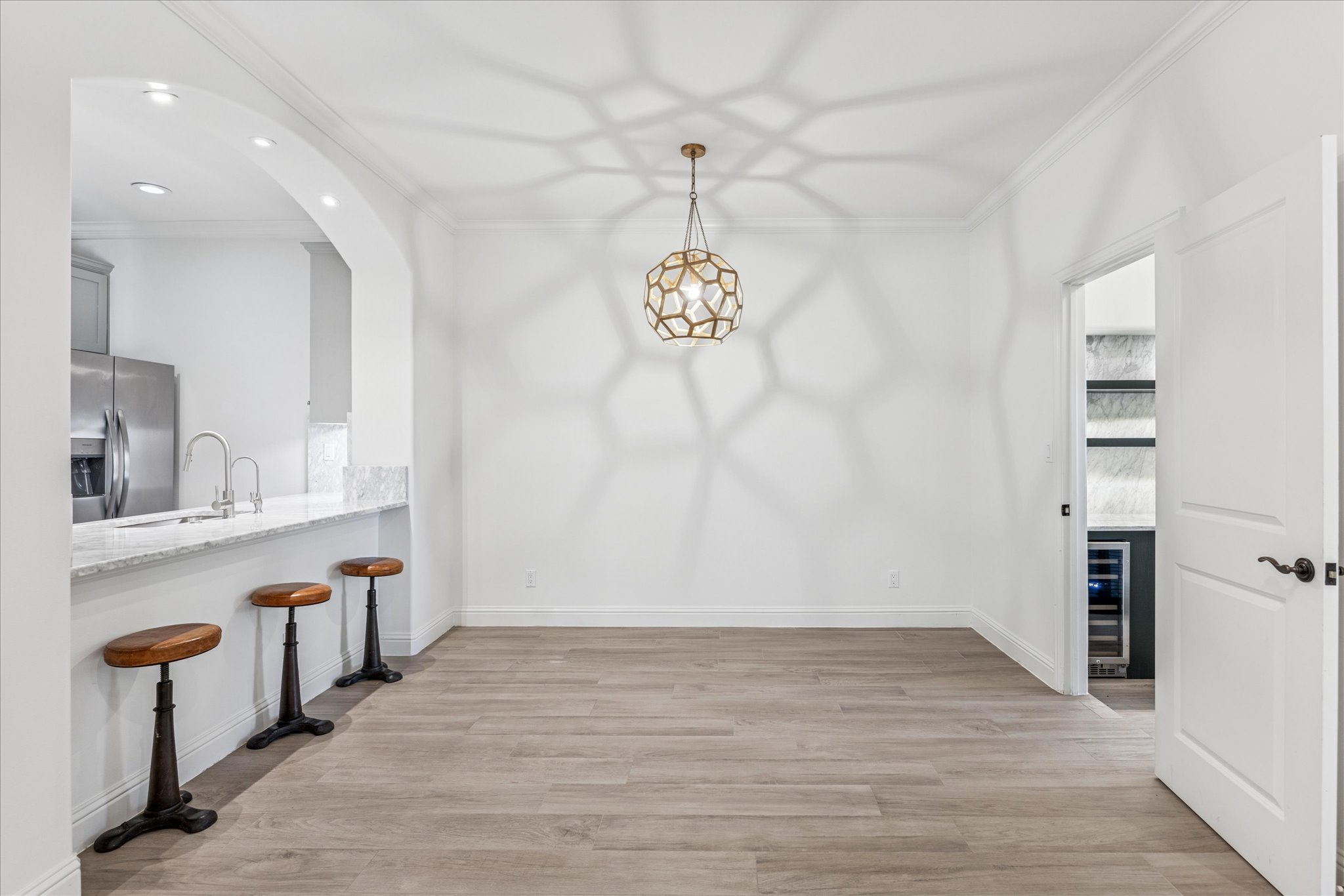 3303 Pecos Street, Unit B Austin, TX 78703 - Photo 8 of 30 wooden floor in an empty room with a window