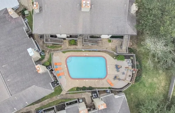 an aerial view of a house with outdoor space