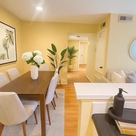 a kitchen with a table and chairs