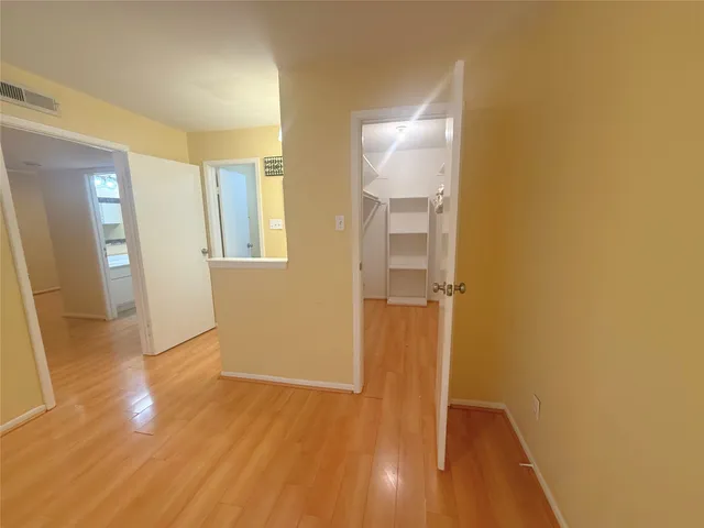 a bathroom with a granite countertop sink toilet and shower a mirror