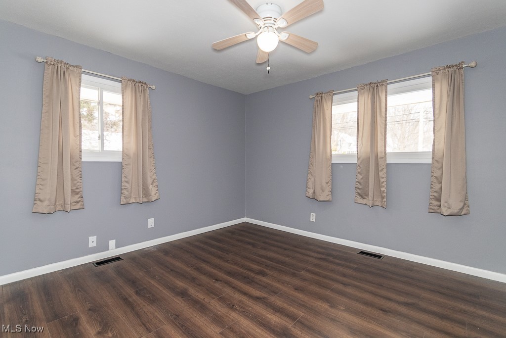 7996 Munson Road Mentor, OH 44060 - Photo 23 of 33 Spare room featuring dark hardwood / wood-style floors and ceiling fan