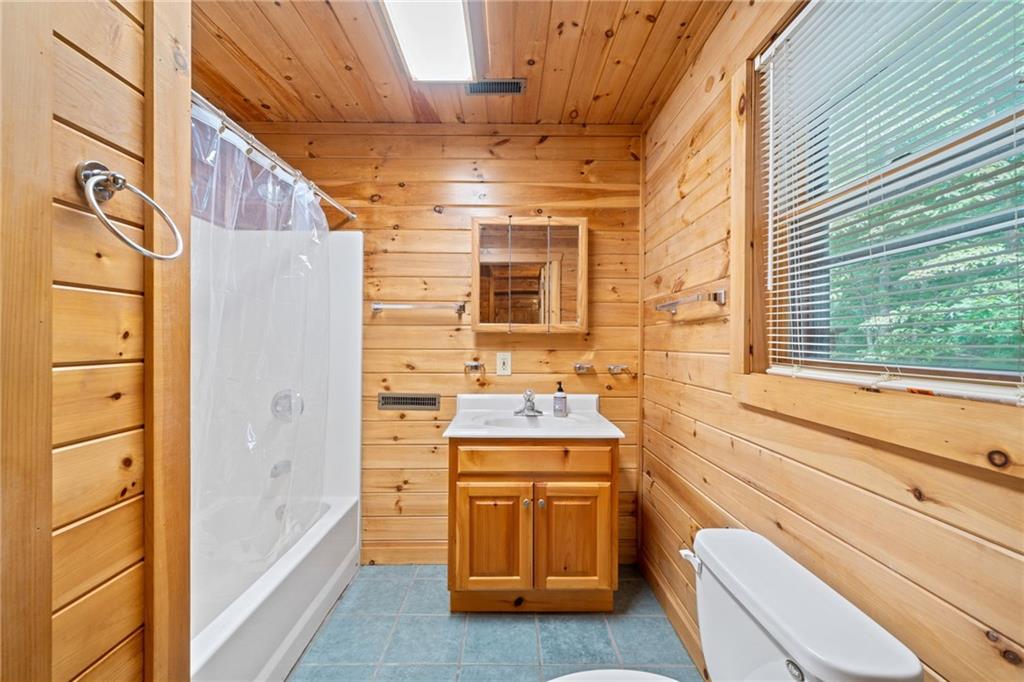 5 Tally Mountain Road North Jasper, GA 30143 - Photo 16 of 58 a bathroom with a sink and a bathtub