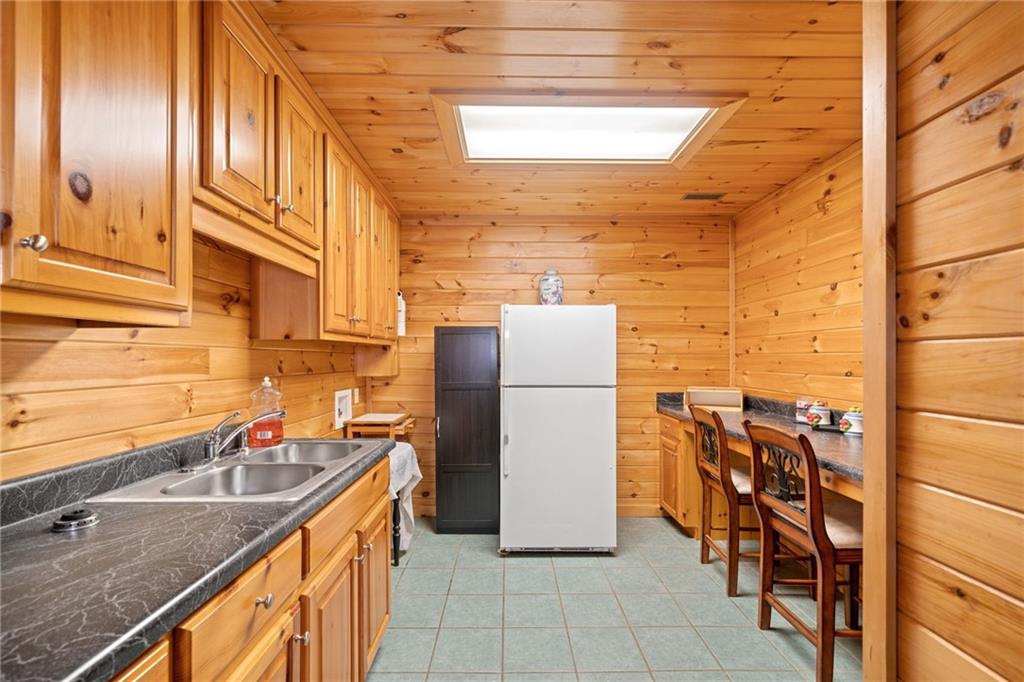5 Tally Mountain Road North Jasper, GA 30143 - Photo 17 of 58 a kitchen with stainless steel appliances granite countertop a sink and a refrigerator