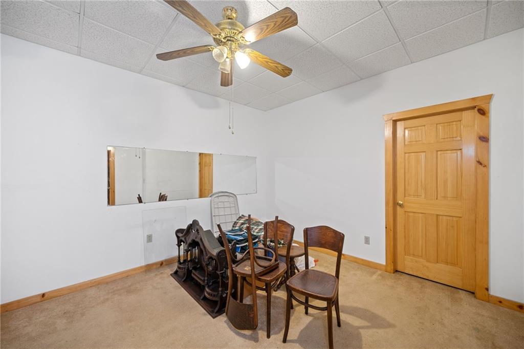 5 Tally Mountain Road North Jasper, GA 30143 - Photo 19 of 58 a view of a dining room with furniture and a chandelier fan
