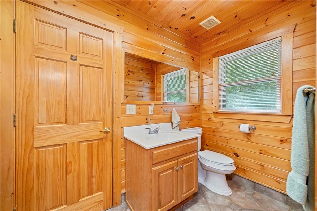 5 Tally Mountain Road North Jasper, GA 30143 - Photo 26 of 58 a bathroom with a sink a toilet and mirror