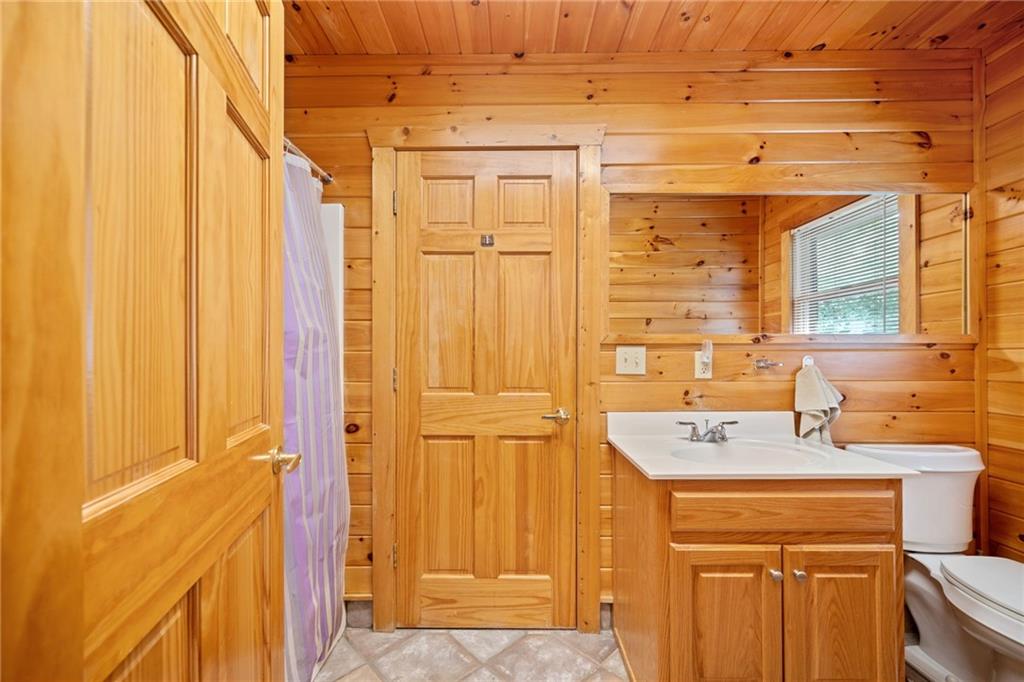 5 Tally Mountain Road North Jasper, GA 30143 - Photo 27 of 58 a bathroom with a sink a mirror and a shower