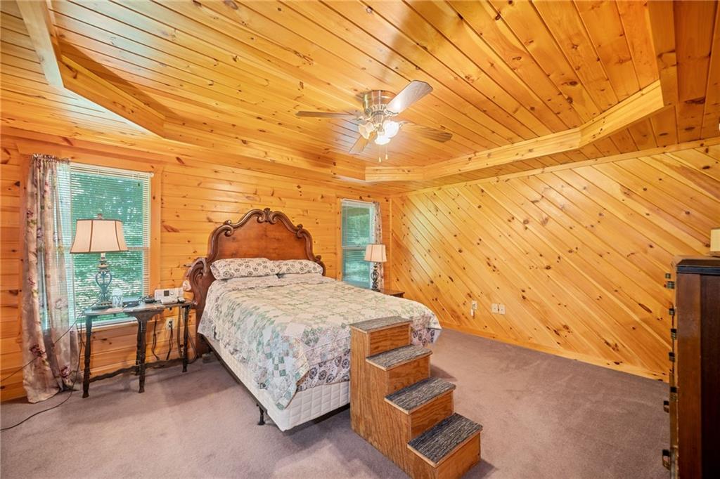 5 Tally Mountain Road North Jasper, GA 30143 - Photo 28 of 58 a bedroom with a bed and wooden floor