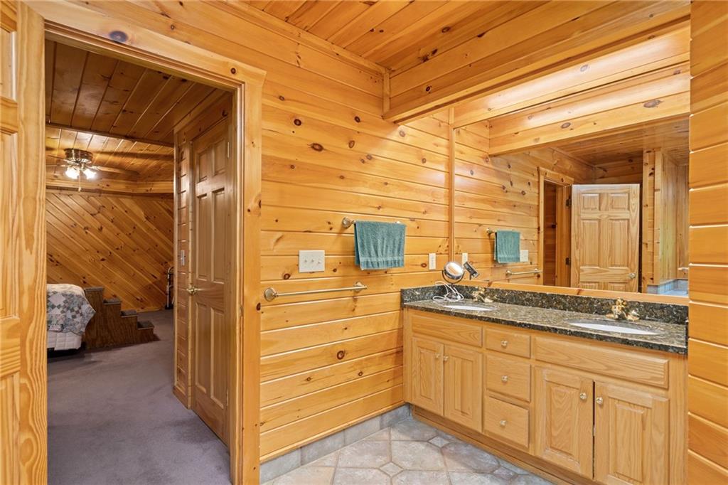5 Tally Mountain Road North Jasper, GA 30143 - Photo 33 of 58 a bathroom with a sink and mirror with shower