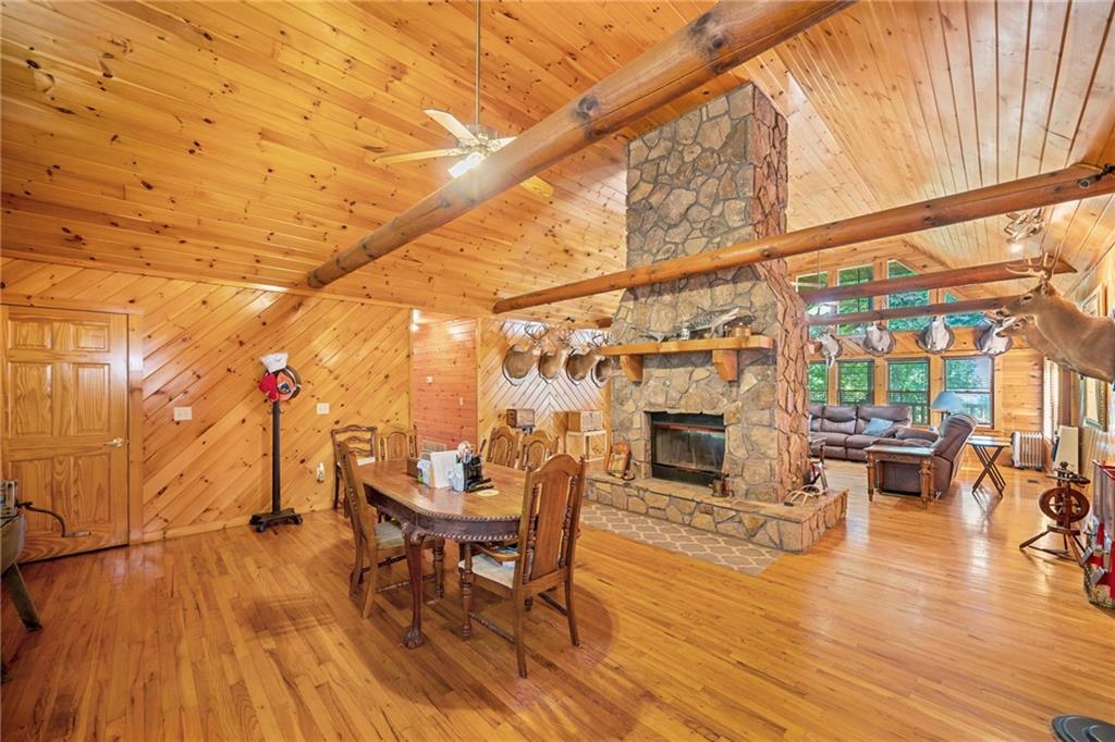 5 Tally Mountain Road North Jasper, GA 30143 - Photo 40 of 58 a living room with fireplace furniture and a wooden floor