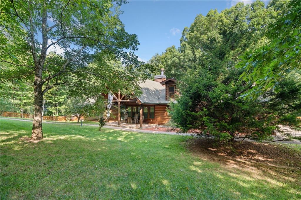5 Tally Mountain Road North Jasper, GA 30143 - Photo 51 of 58 a view of a house with a big yard and large tree