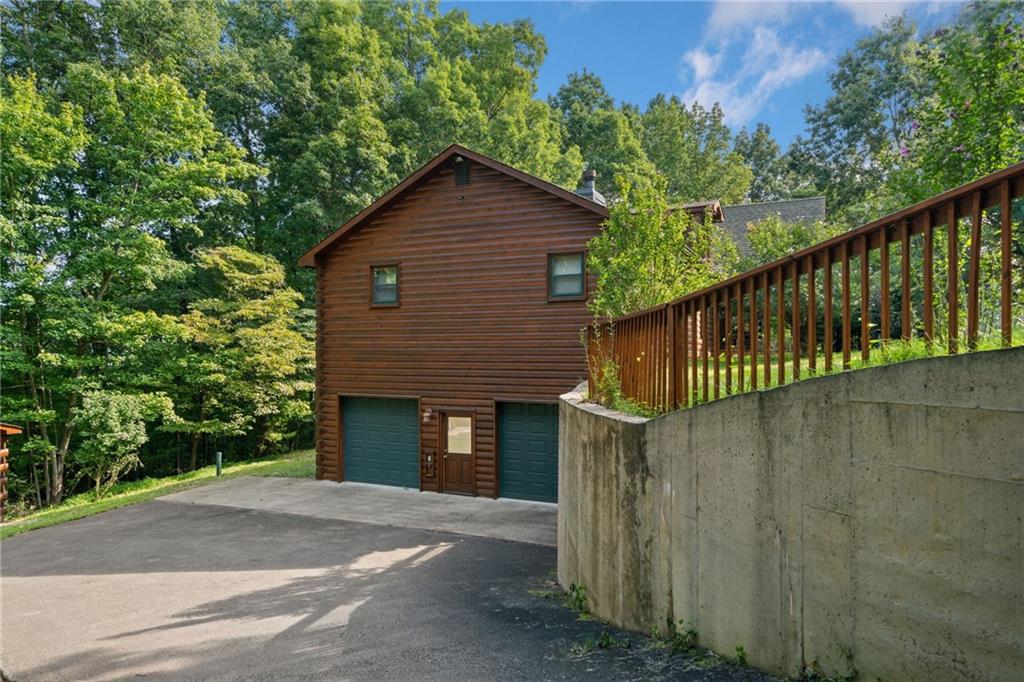 5 Tally Mountain Road North Jasper, GA 30143 - Photo 53 of 58 a view of a house with a yard plants and large tree