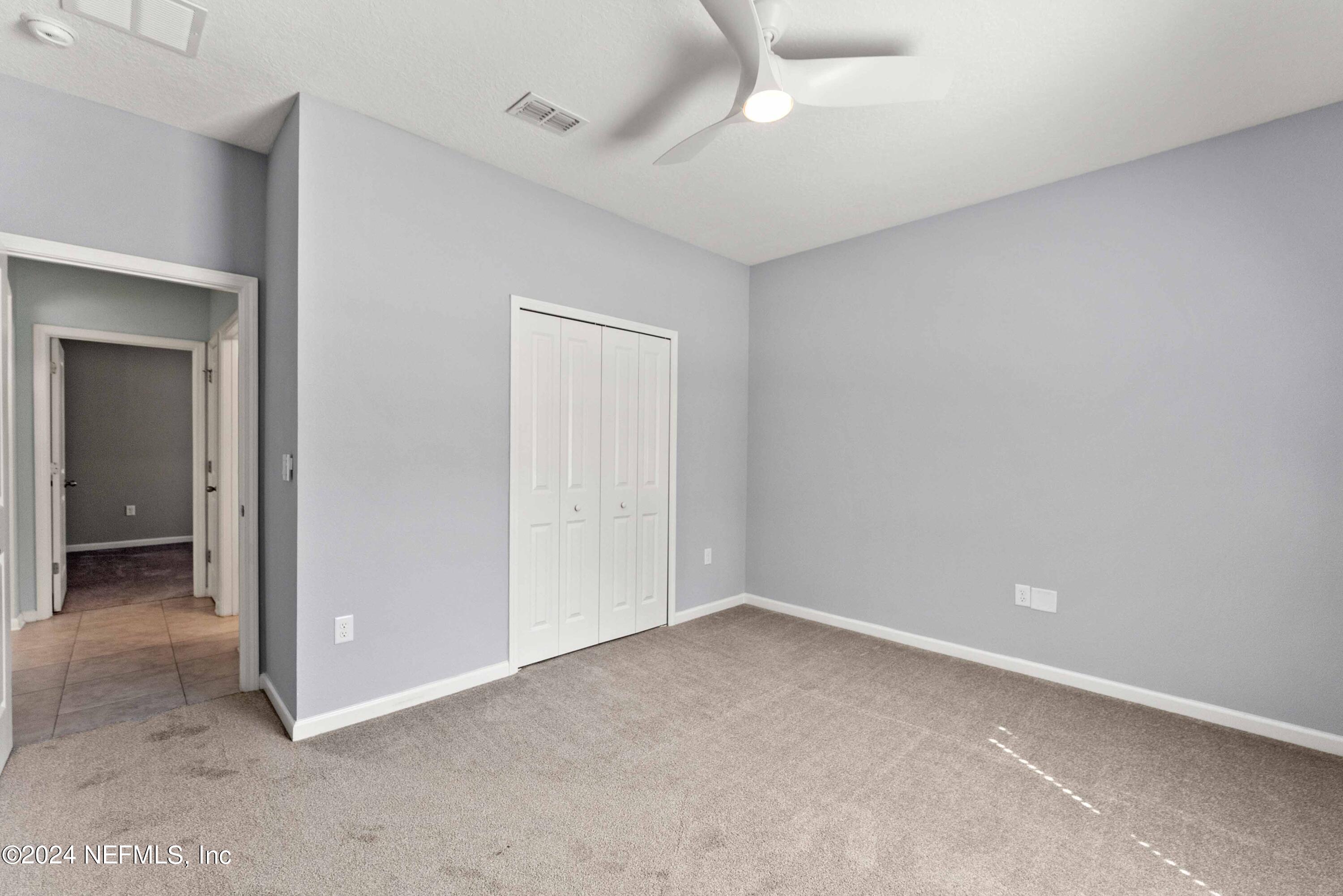 15 Greenview Lane St. Augustine, FL 32092 - Photo 15 of 41 an empty room with a empty space and a ceiling fan