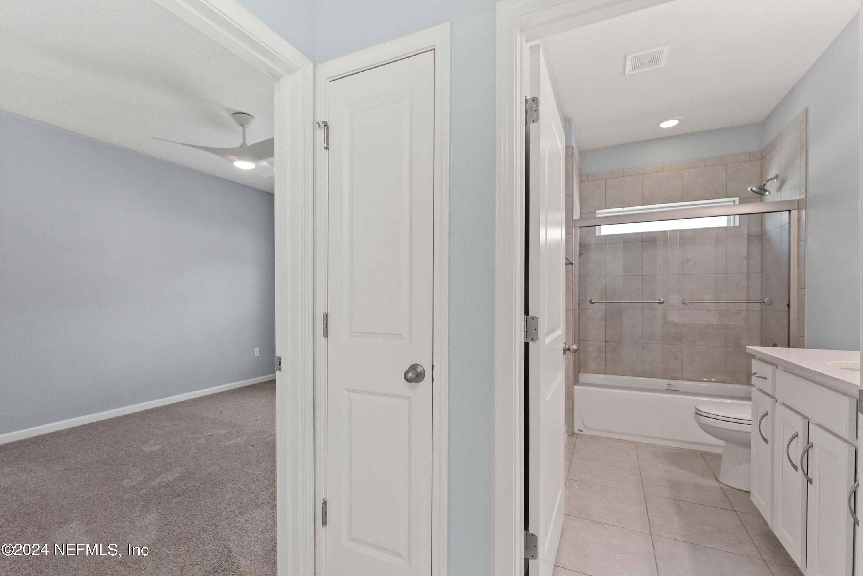 15 Greenview Lane St. Augustine, FL 32092 - Photo 17 of 41 a bathroom with a shower and a glass door