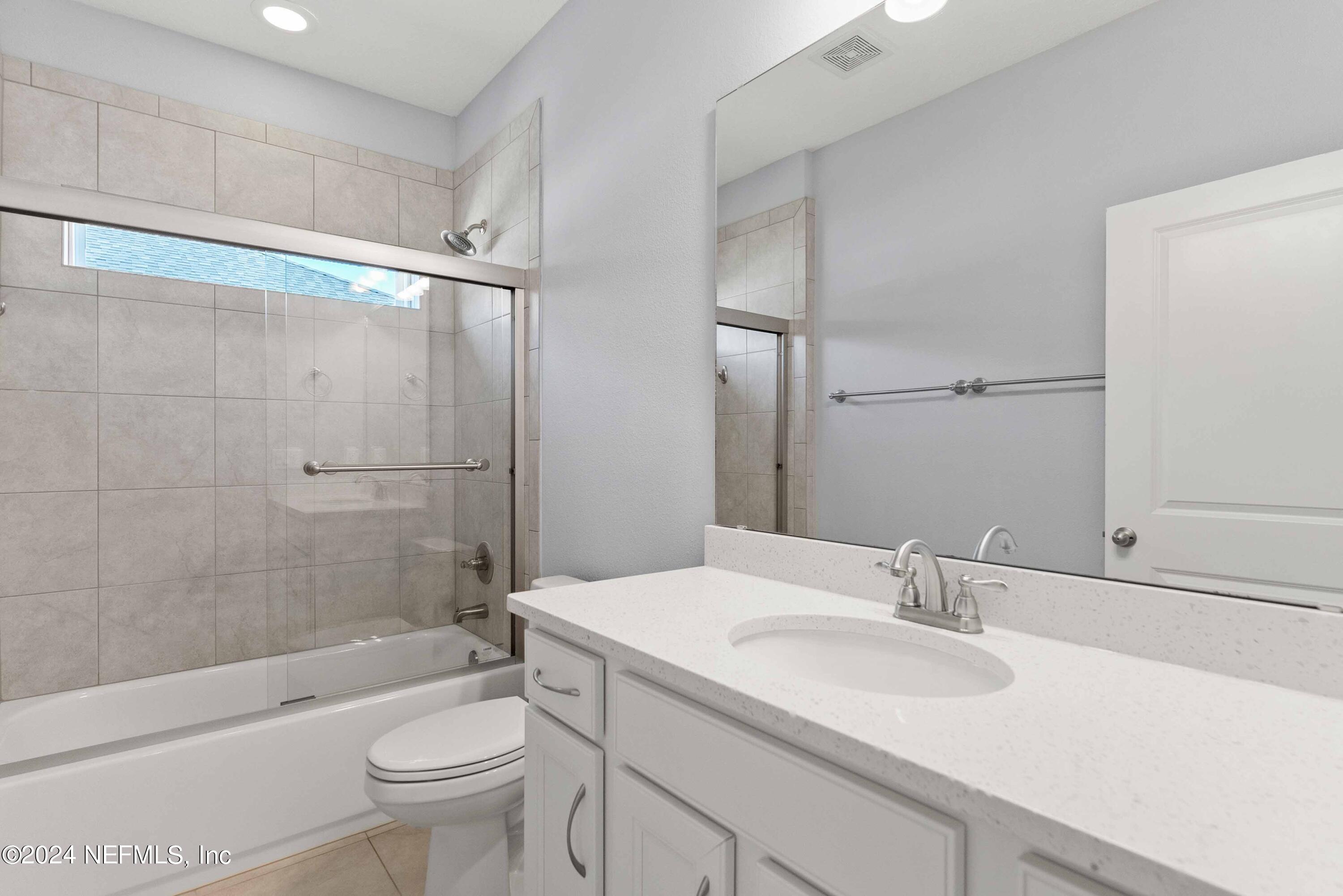 15 Greenview Lane St. Augustine, FL 32092 - Photo 20 of 41 a bathroom with a sink a toilet and shower