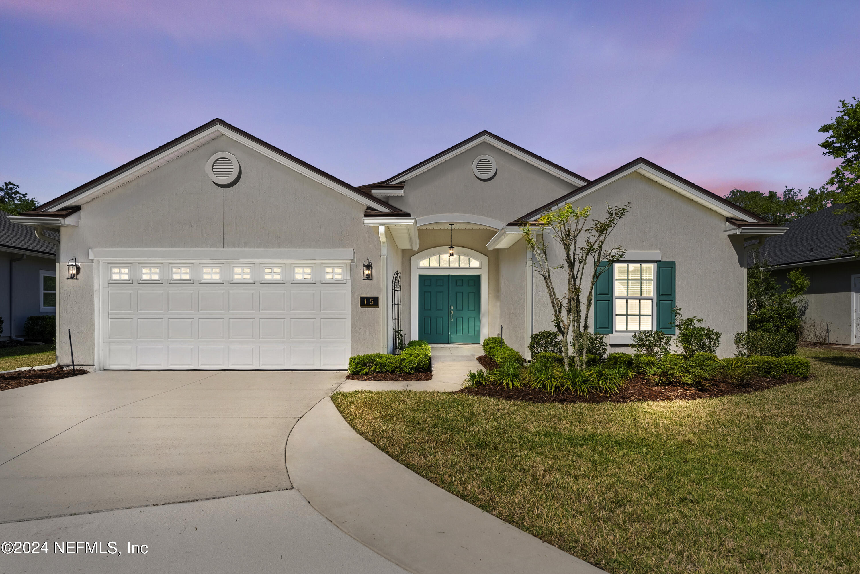 15 Greenview Lane St. Augustine, FL 32092 - Photo 2 of 41 a front view of a house with garden