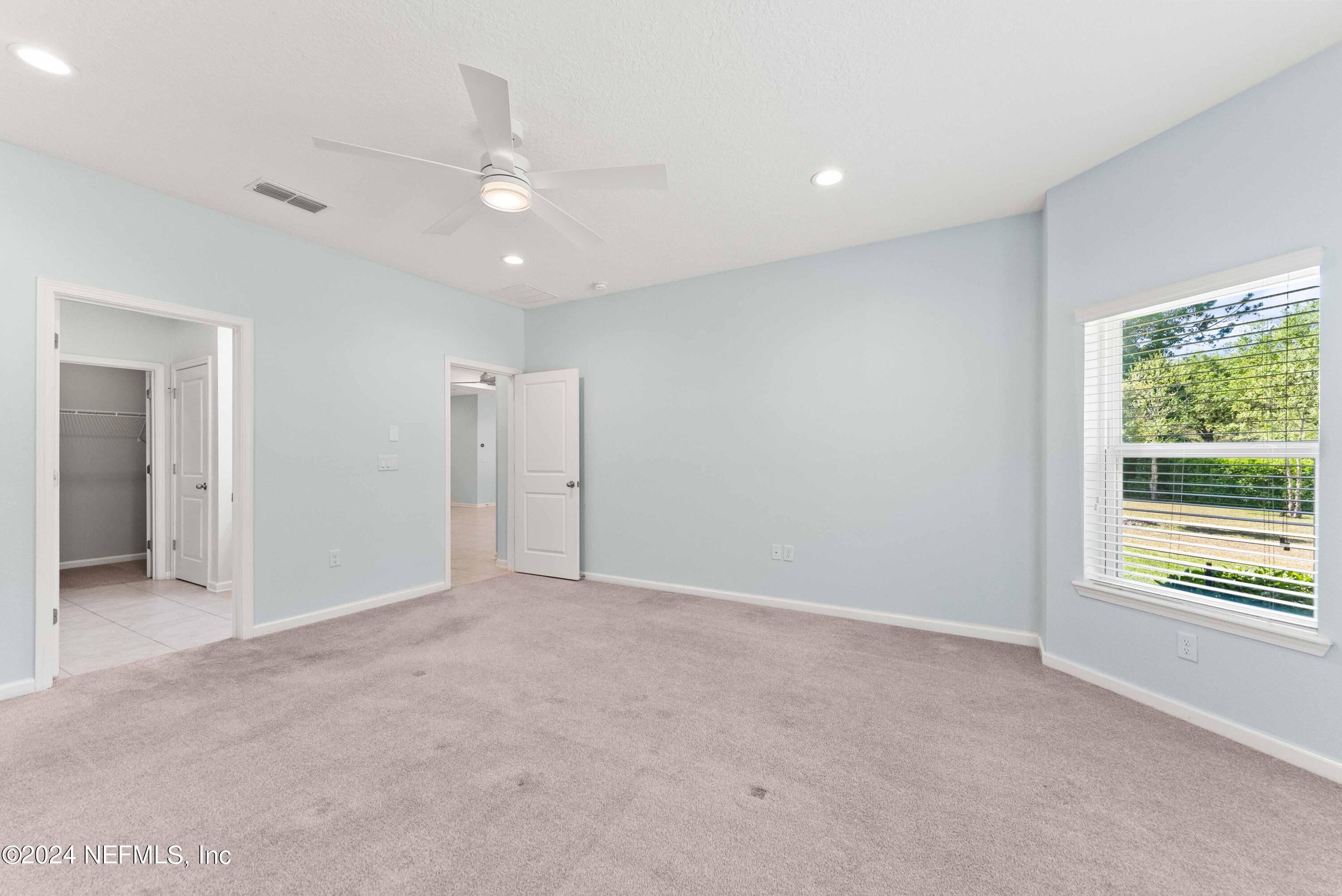 15 Greenview Lane St. Augustine, FL 32092 - Photo 22 of 41 an empty room with windows and closet