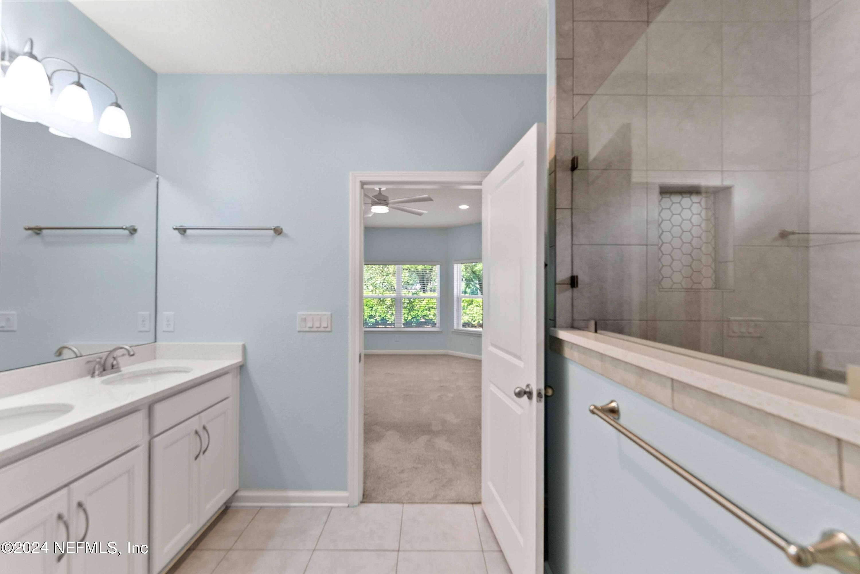 15 Greenview Lane St. Augustine, FL 32092 - Photo 25 of 41 a bathroom with a double vanity sink toilet and shower