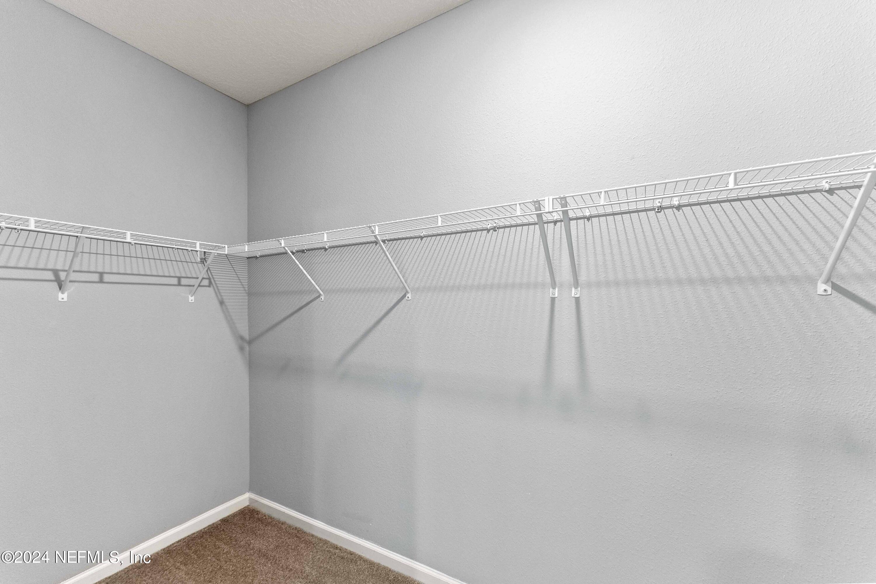 15 Greenview Lane St. Augustine, FL 32092 - Photo 28 of 41 a view of a room with racks on the wall