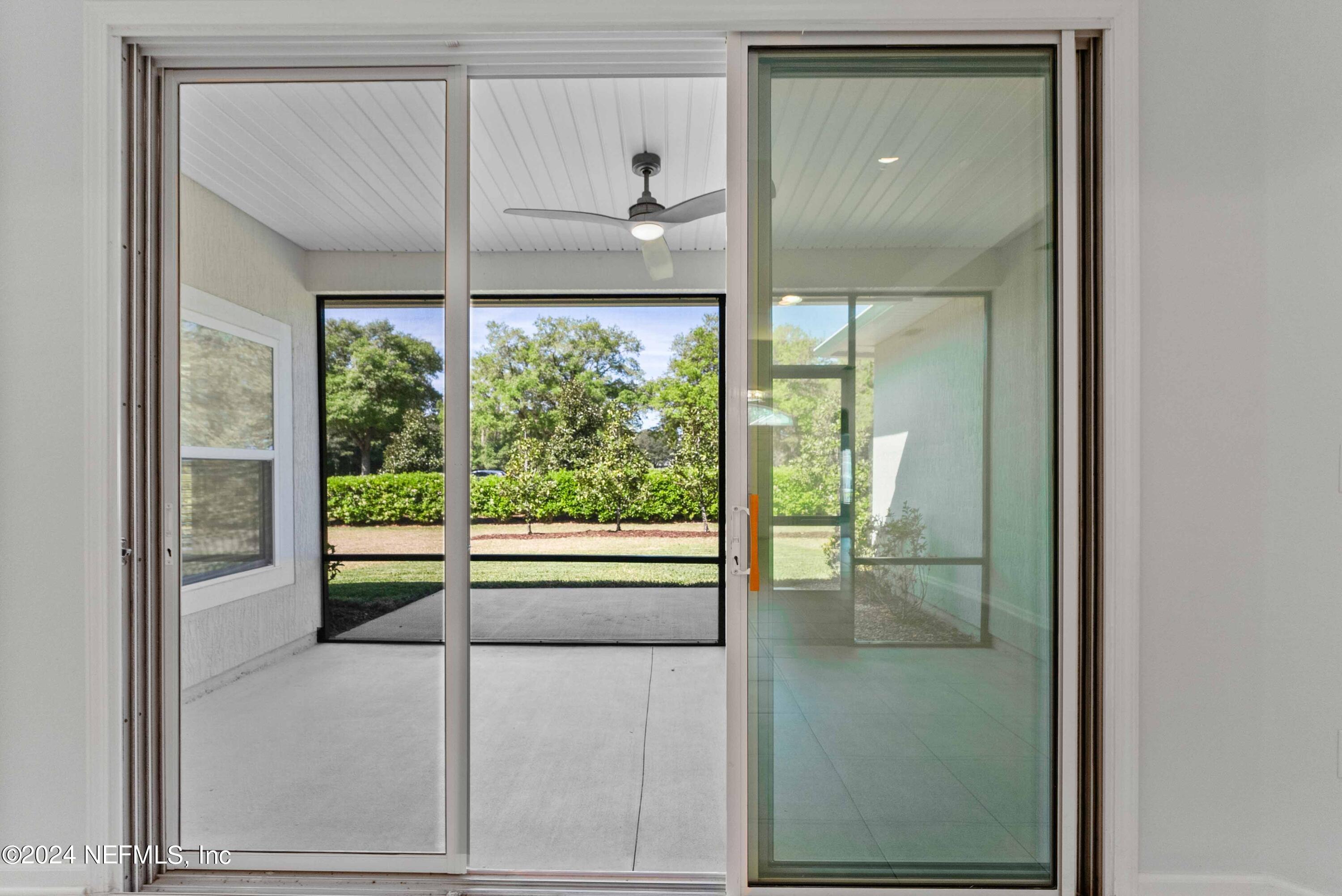 15 Greenview Lane St. Augustine, FL 32092 - Photo 30 of 41 a view of a glass door with a yard from a window