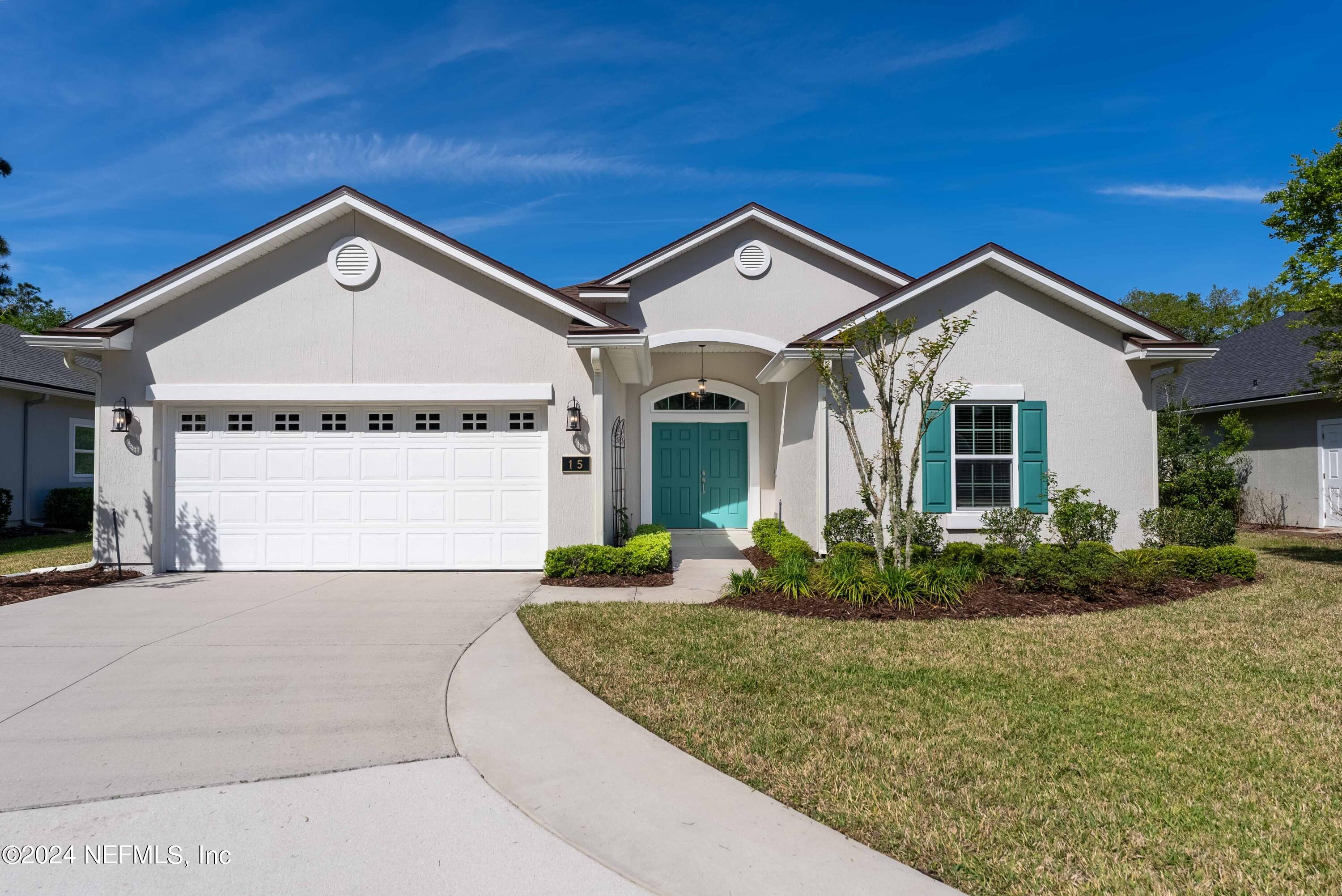 15 Greenview Lane St. Augustine, FL 32092 - Photo 3 of 41 a front view of a house with garden