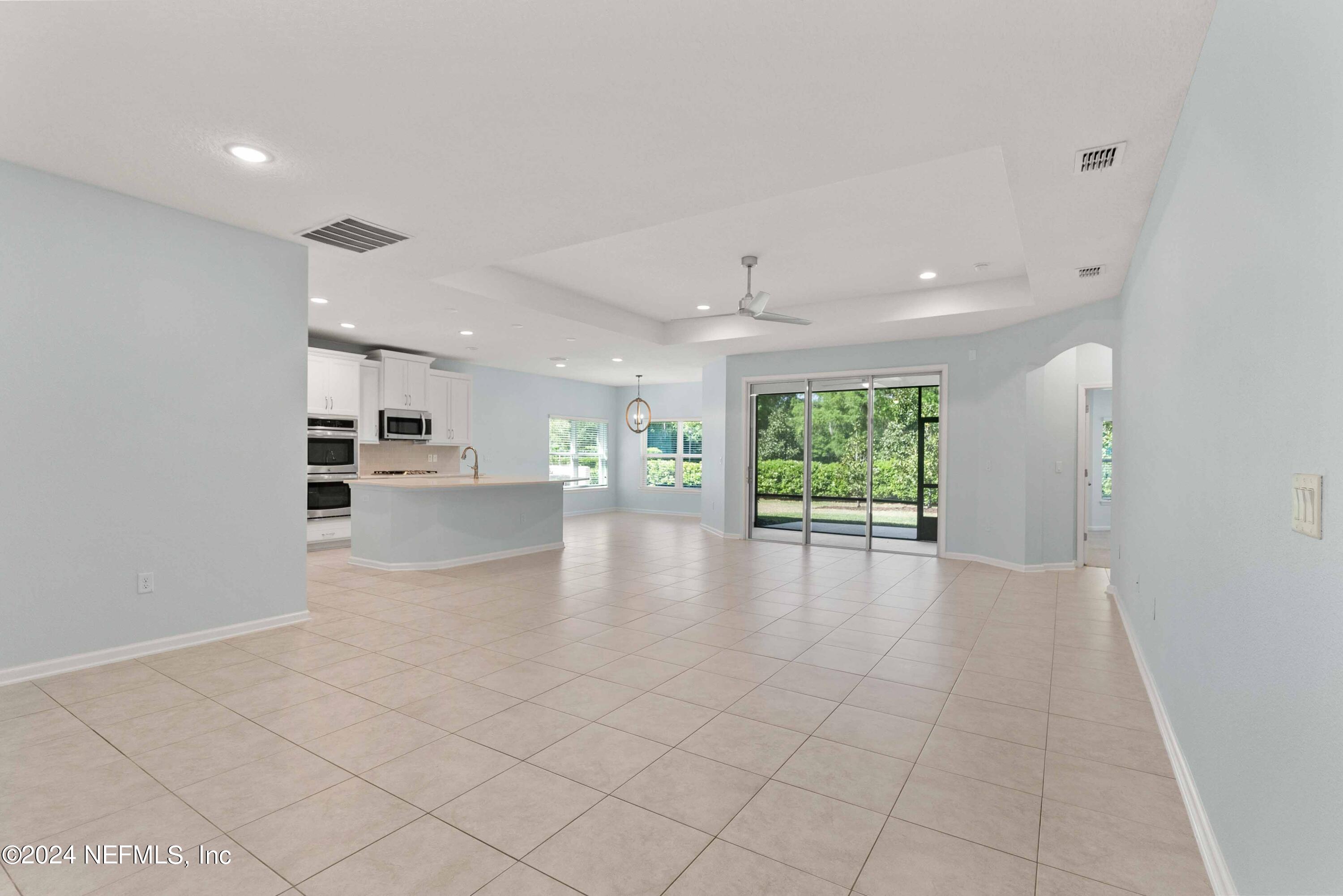 15 Greenview Lane St. Augustine, FL 32092 - Photo 7 of 41 a view of an empty room with a window and kitchen view