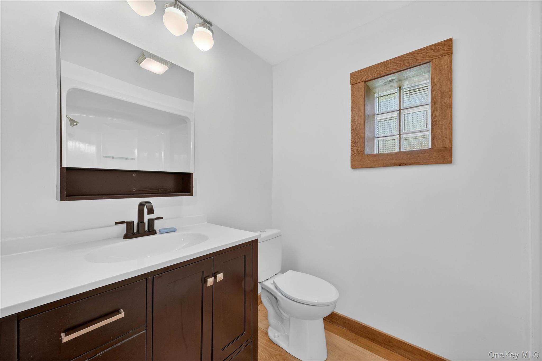 71 Blacks Road Kingston, NY 12401 - Photo 15 of 20 a bathroom with a toilet sink double vanity and mirror